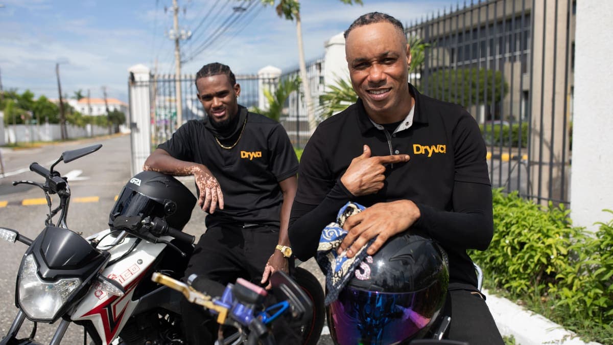 Two Dryva riders with their motorbikes